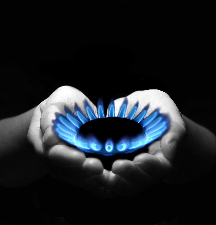 Hands holding a gas flame