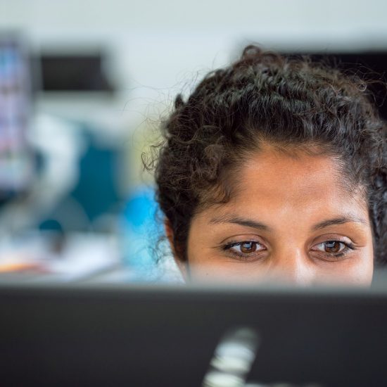 Image of a woman working in an office with air conditioning